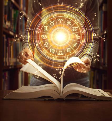 Woman reading a astrology book. Astrological wheel projection, choose a zodiac sign. Trust horoscope future predictions, consulting stars. Power of universe, astrology esoteric concept.