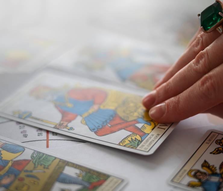high-angle-woman-reading-tarot (1)